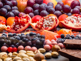 Healthy super food selection background as fruits, berry, chocolate High in antioxidants, magnesium, resveratrol, vitamins, minerals and anthocyanins.