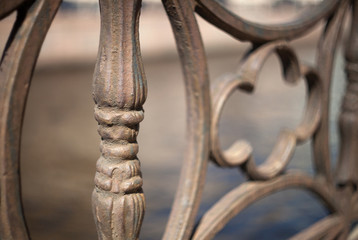 Detail of vintage cast-iron casting from the canal fence in St. Petersburg with a blurred background