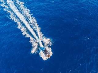 Speed boat in motion. Summer leisure time activity. Aerial top view