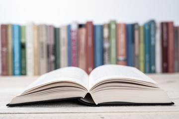 Open books close-up in library, toned color background