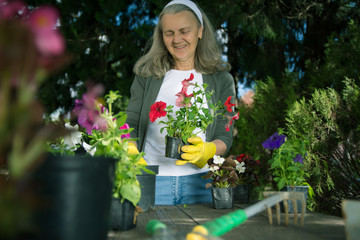 Smiling senior gardener