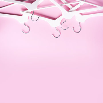 White clothes hangers on pink background with copy space. Flat lay. Top  view. Minimalism style. Creative layout. Fashion, store sale, shopping  concept. Banner for feminine blog Stock Photo | Adobe Stock