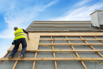 Fototapeta premium Building construction process of new wooden roof on wood frame house