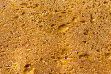 Homemade bread closeup, natural background texture.