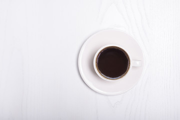 Coffee cup top view on wooden white table background