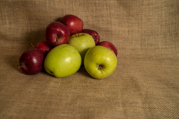 red and green apples of a sackcloth