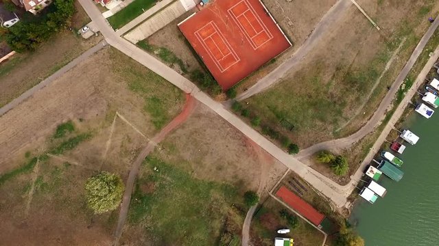 Novi Becej playing ground and Tisa river from above, aerial view in autumn. 2018