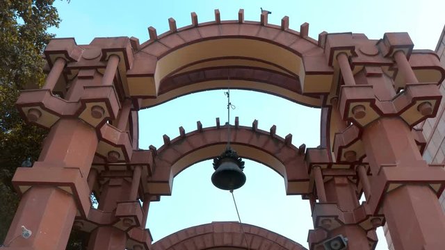 The entrance to the modern temple complex Iskcon, New Delhi, India. Shot in motion