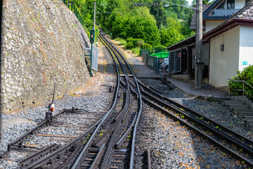 Cog railway tracks with an additional toothed rack located in the middle of the track to overcome large tilts.