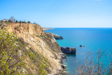 Scenic view of the waves of the blue sea among the rocks.