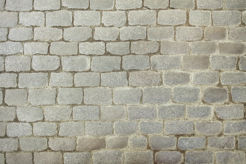 Obraz premium Old grey stone pavement background texture