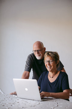 Couple using technolgy at home
