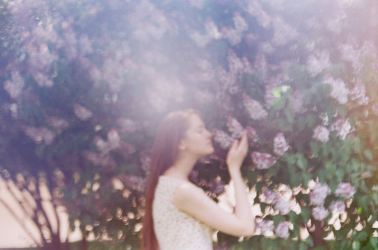 Atmosheric portrait of young woman in springtime