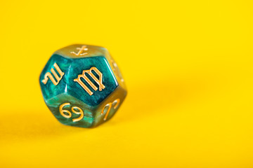 Astrology Dice with zodiac symbol of Virgo Aug 23 - Sep 22 on Yellow Background