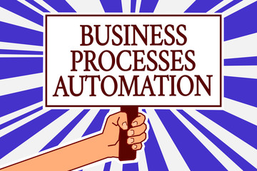 Text sign showing Business Processes Automation. Conceptual photo performed to achieve digital transformation Man hand holding poster important protest message blue rays background