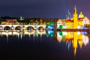 Fototapeta na wymiar Prague architecture and Charles bridge over Vltava river at night, Czech Republic