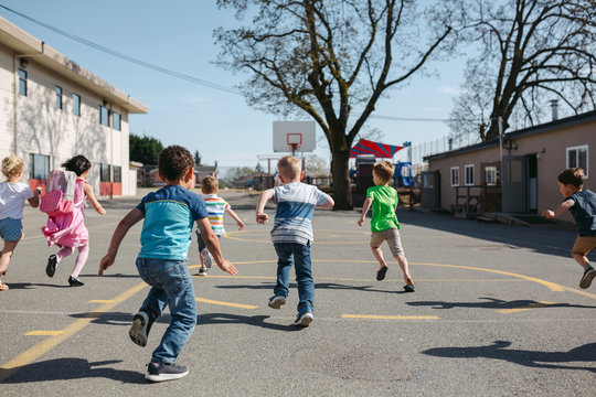 Running preschool kids outside