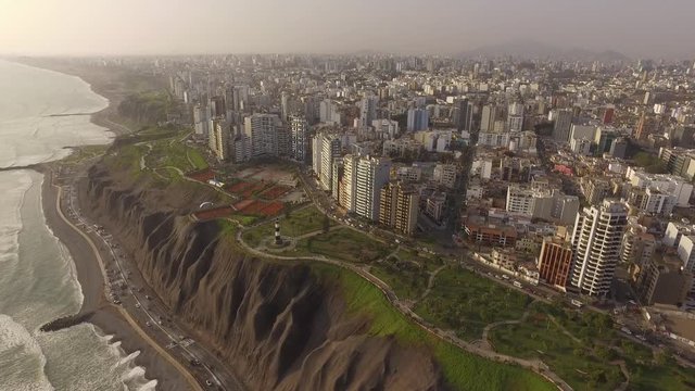 Forward and over pass drone view of Miraflores, Lima, peru at sunset
