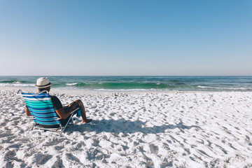 Black man relaxing on the beach