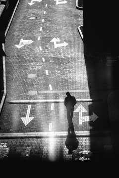Unidentified man walks along the road