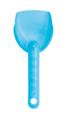 Small plastic toy shovel isolated on a white background.
