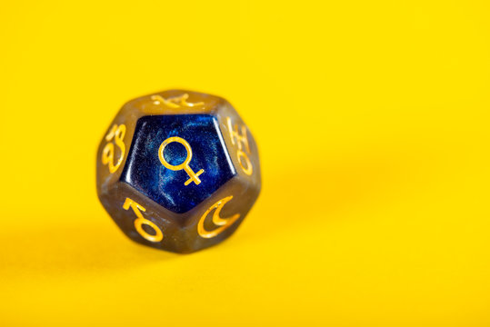 Astrology Dice with symbol of the planet Venus on Yellow Background