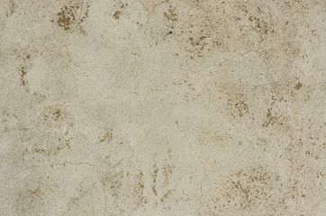 Photo of light concrete texture of the background with cracks. Wall background
