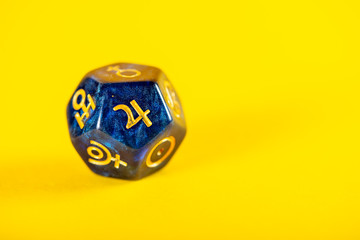 Astrology Dice with symbol of the planet Jupiter on Yellow Background