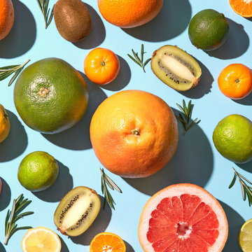 sliced citrus pattern on blue background. Healthy food