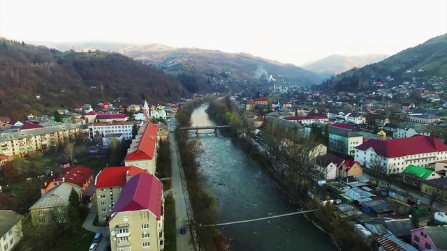 Aerial view of Tisa river and Rakhiv town square in autumn.2018