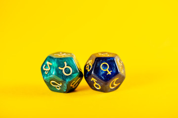 Astrology Dice with zodiac symbol of Taurus Apr 20 - May 20 and its ruling planet Venus on Yellow...