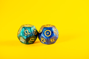 Astrology Dice with zodiac symbol of Leo Jul 23 - Aug 22 and its ruling celestial body the Sun on...