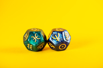 Astrology Dice with zodiac symbol of Pisces Feb 19 - Mar 20 and its ruling planet Neptune on Yellow...
