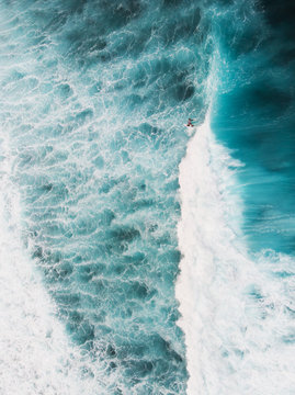 Surfer Surfing Wave -  Aerial Shot