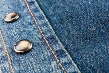 clothing items blue stonewashed faded jeans cotton fabric texture with seams, clasps, buttons and...