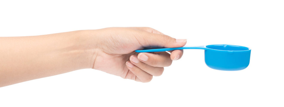 hand holding blue plastic scoop isolated on white background