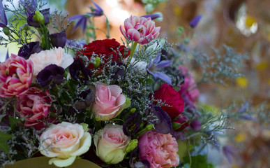 a bouquet of red white flowers of red and pink roses