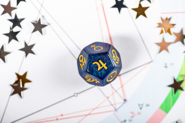 Astrology Dice with symbol of the planet Jupiter on Natal Chart Background