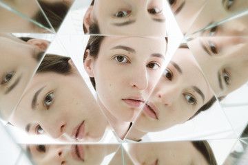 Face of woman reflected