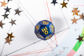 Astrology Dice with symbol of the planet Uranus on Natal Chart Background