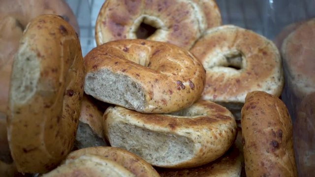 Pile of whole wheat bagels, Close Up Pedestal Shot