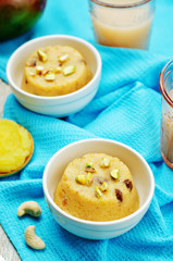 Indian Sooji mango Halwa on a wood background