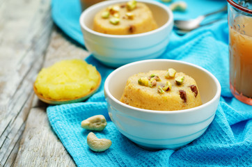 Indian Sooji mango Halwa on a wood background