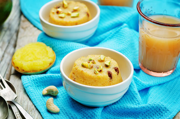 Indian Sooji mango Halwa on a wood background