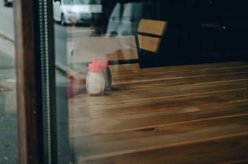 View from the window in the cafe, empty table, salt on the table