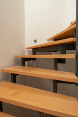 Obraz premium design wooden staircase with steel construction and white walls in a new house