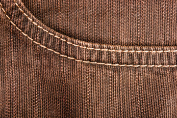 clothing items stonewashed cotton fabric texture with seams, clasps, buttons and rivets, macro