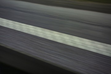 View of white road marking line isolated during high speed moving, Transportation concept....