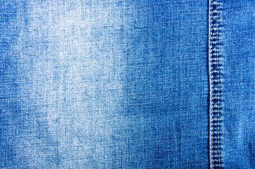 clothing items blue stonewashed faded jeans cotton fabric texture with seams, clasps, buttons and...