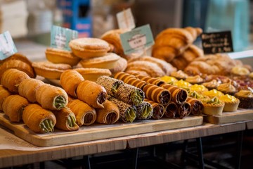 Fototapeta premium Delicious Italian Cannoli and Pastries on Display